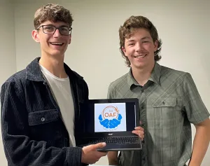 Seniors Evan and Max present their prototype logo