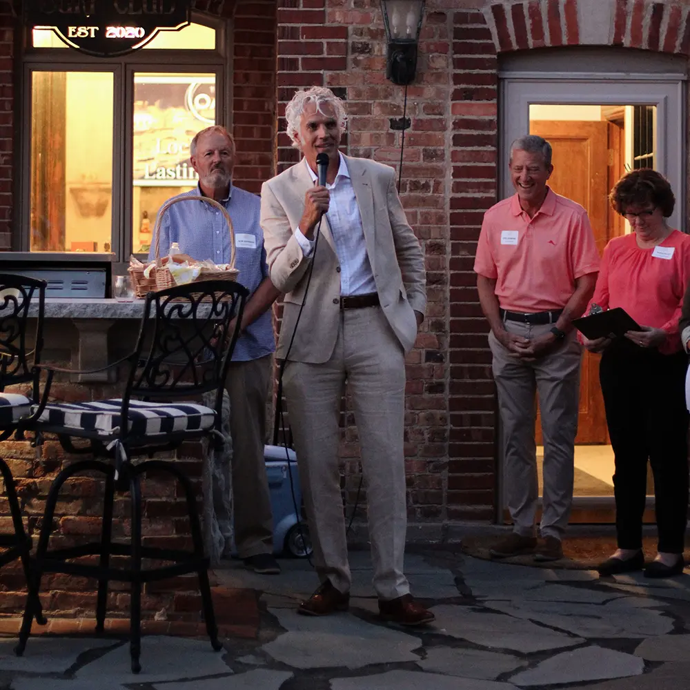 founding member Craig Schiefelbein spoke to a crowd of more than 150 founding member Craig Schiefelbein spoke to a crowd of more than 150